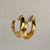 Golden wave curve earrings