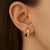 Golden curl hoops earrings