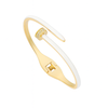 Gold and white bangle on a white background