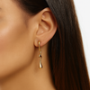 Wavy gild hoops earrings